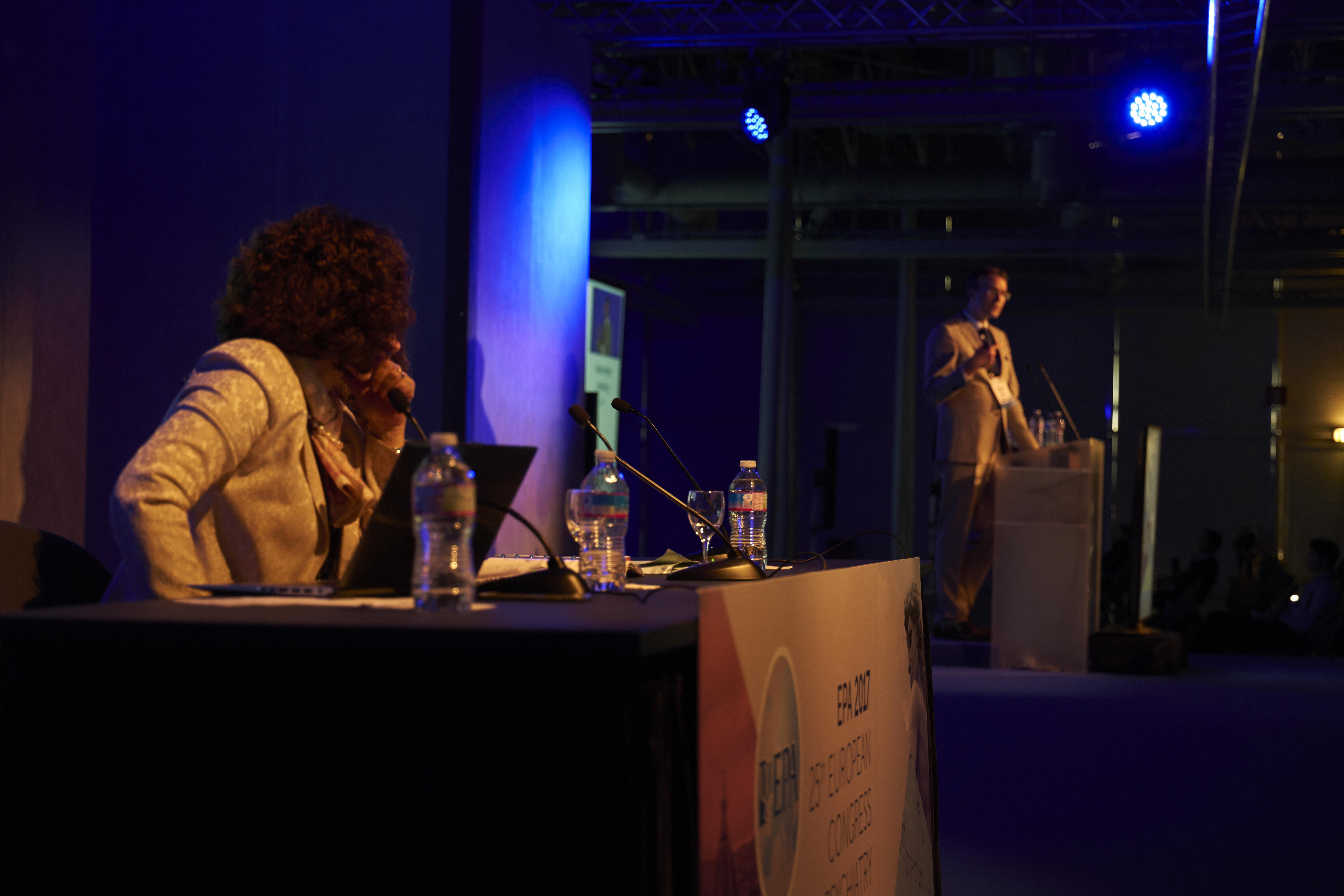 Speakers sit and stand