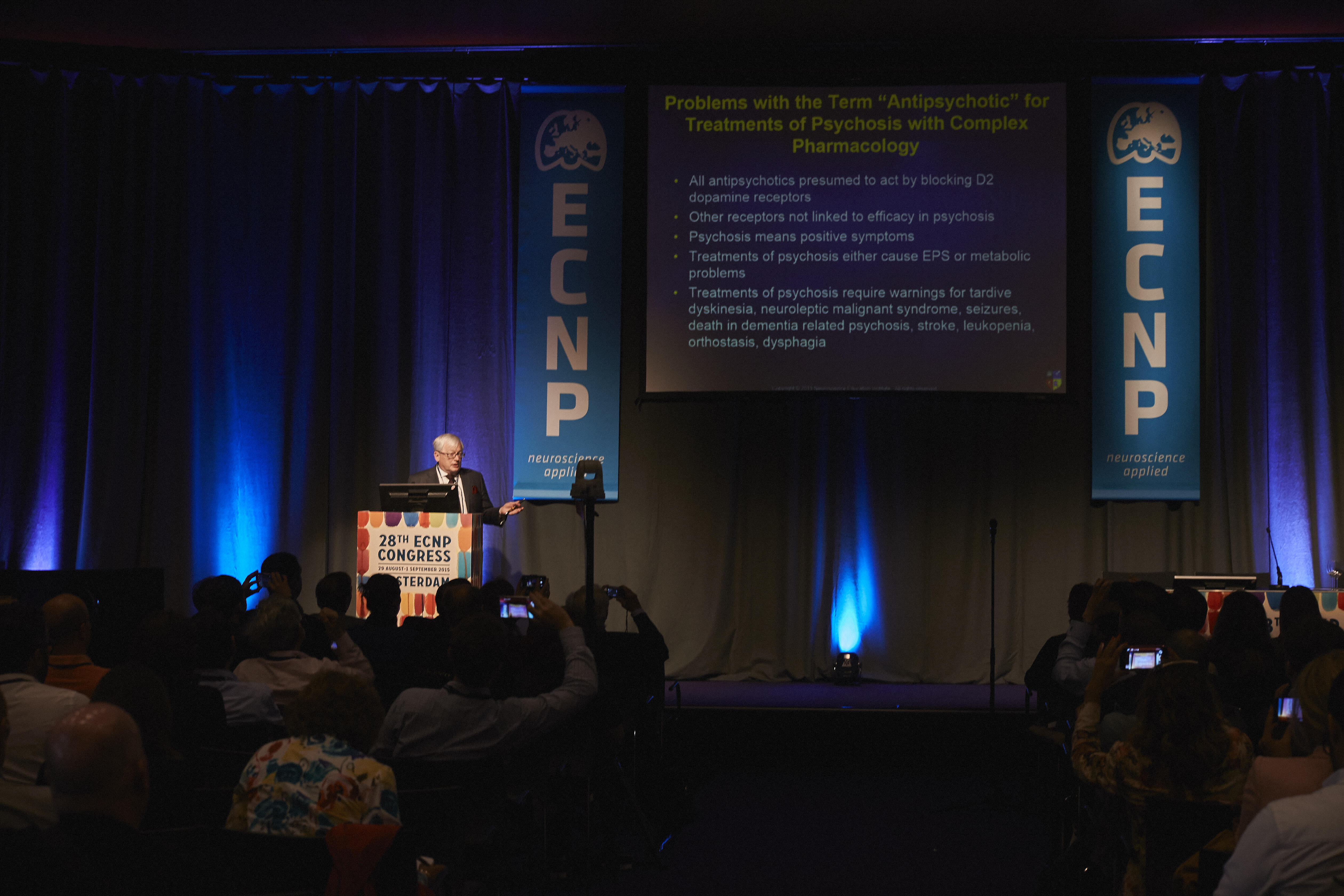 Doctors listen to a speaker.